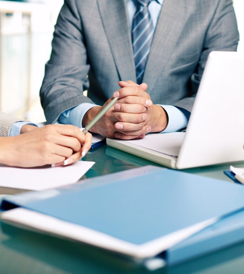 close-up-executives-sitting-table_1098-2159.avif.avif